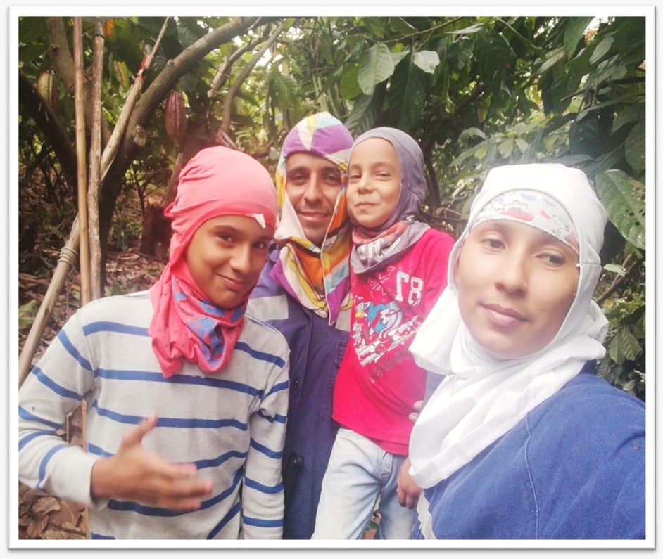 Diego, Marcela, and their children in the cocoa fields. Photo by Diego Marín.